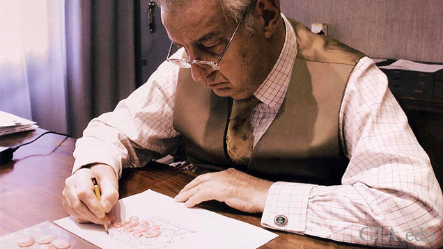 Gianmaria Buccellati hand sketching a jewelry design on paper. Gianmaria Buccellati hand sketching a jewelry design on paper.