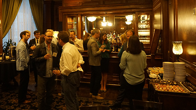 Group of people talking at dinner reception