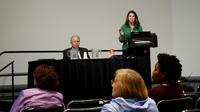 A female presenting her research