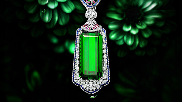 Emerald-cut green tourmaline with fancy cut diamonds, pink an green tourmaline, and blue sapphire necklace