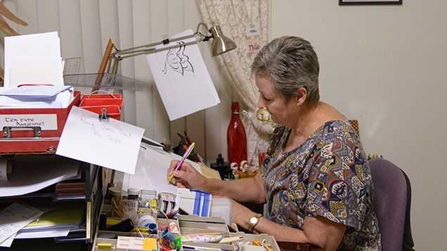 Woman sketching at desk