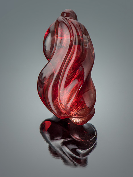 Figure 17. A 31.12 ct Oregon sunstone carving by Larry Woods. Photo by Robert Weldon; courtesy of John D. Woodmark, Desert Sun Mining & Gems.