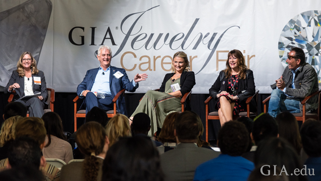 The opening panel, “Job Success in Today’s Market.” From left: Jennifer Wilson, GIA senior vice president and general counsel; Douglas K. Hucker, CEO of American Gem Trade Association (AGTA); Meghan Simmons, director of operations at Omi Privé; Cathy Calhoun, owner of Calhoun Jewelers; and Mitchell Binder, president and designer of King Baby. Photo by Emily Lane/GIA. 