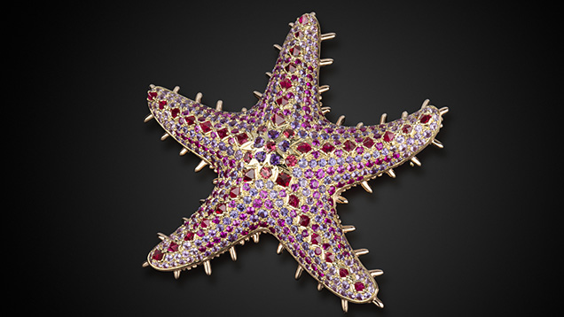 Sea star pendant featuring ruby, sapphire, spinel, and amethyst.