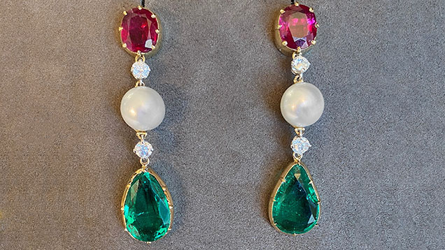 A pair of earrings with unoiled emeralds weighing about 8 ct total, natural pearls measuring 9.5–10.0 mm, unheated Burmese rubies weighing just under 5 ct total, and diamonds set in yellow gold. Photo courtesy of ProVockative Gems Inc.