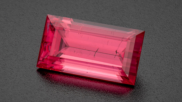 A 7.94 ct rectangular step-cut rhodochrosite from the Sweet Home mine in Colorado’s Alma Mining District. Photo by Robert Weldon; courtesy of Barker & Co.