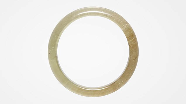 Figure 1. A 144.67 ct Libyan Desert glass bangle measuring 66.12 × 13.10 mm. Photo by Johnny Leung.