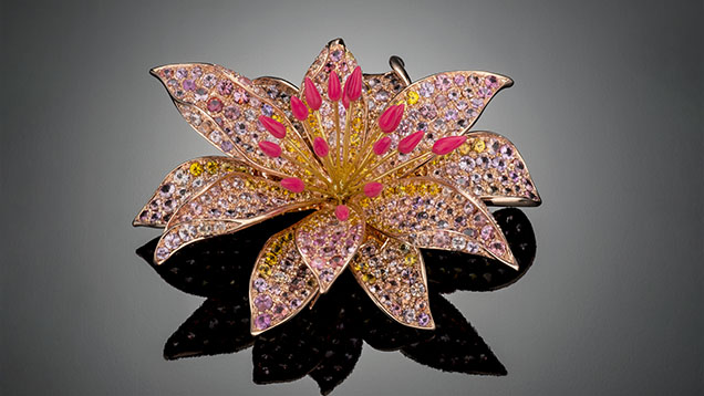 Figure 3. The “Bitterroot Flower” brooch by Paula Crevoshay contains nearly 400 Montana sapphires: 79 pink (6.03 carats total), 116 yellow (7.46 carats total), and 202 additional fancy-color (16.26 carats total). Photo by Robert Weldon; courtesy of Paula Crevoshay.