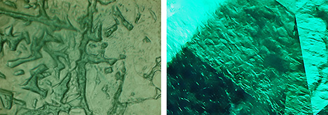 Figure 24. Patterns seen in faceted Colombian <em>gota de aceite</em> emeralds display numerous irregular hillocks, columns, or walls. The left image is viewed in immersion, parallel to the <em>c</em>-axis. Photomicrographs by K. Schmetzer (left) and M.P.H. Curti, Bellerophon Gemlab (right); fields of view 1.9 mm (left) and 1.6 mm (right).