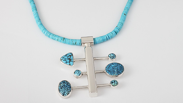 Figure 3. Nebula series necklace by Sam Patania, featuring sterling silver and spiderweb turquoise from the Number 8 mine in Nevada used for the pendant, while the necklace consists of turquoise beads from the Sleeping Beauty mine in Arizona. Photo by Sam Patania; courtesy of Patania Jewelry.