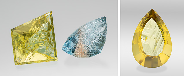 Figure 1. Left: This 109.68 ct heliodor and 80.62 ct bicolor topaz are from the Volyn deposit in Ukraine. They are cut to leave natural etch faces on the pavilion/culet, while the crown and table are faceted. Right: A 162.22 ct pear-cut heliodor. The natural etching patterns are retained on the pavilion and are well displayed through the polished table. Photos by Robert Weldon; courtesy of Nomad’s.