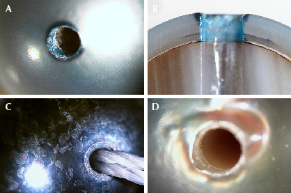 Figure 2. Images showing obvious color concentrations at the drill holes of some samples with darkened bead nuclei (A and B), an unnatural dark patchy surface (C), and a darkened bead nucleus without color concentration (D). Photomicrographs by Emiko Yazawa; fields of view 4.79 mm (A and C) and 3.57 mm (B and D).