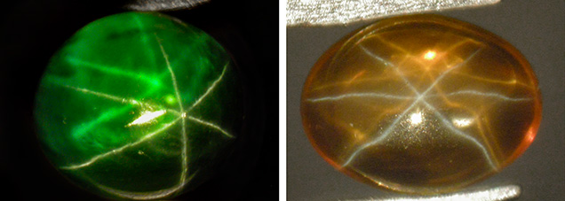 A green and an orange synthetic sapphire cabochon, both with dual-color double asterism