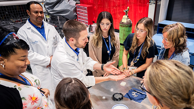 Figure 2. Mechanical engineer and product manager A.J. Brown demonstrated diamond’s outstanding thermal conductivity for the visitors, who used polycrystalline CVD-grown diamond plates produced in the facility to cut through ice cubes with ease. Courtesy of Clarity Diamond.