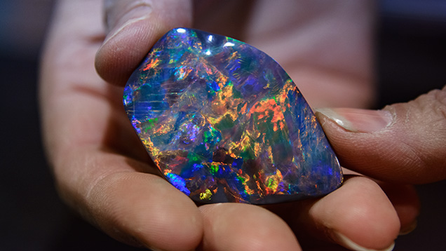 Black seam opal in claystone