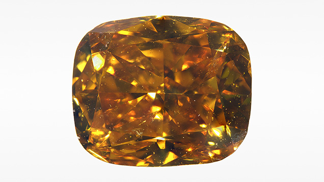 Figure 1. A 1.02 ct Fancy Deep brownish yellowish orange diamond with subsurface etch channels (upper right). Photo by Matthew Hardman.